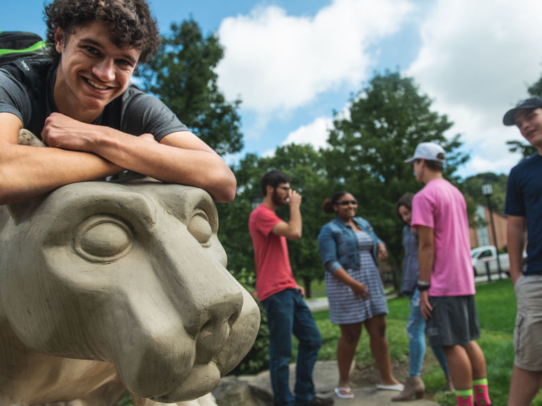 Students at Greater Allegheny grouped near the Lion Shrine statue